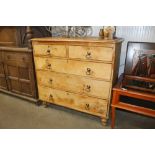 An antique pine chest fitted two short over three