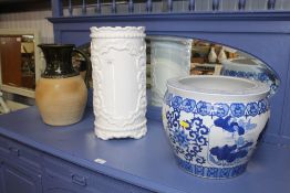 An Oriental blue and white vase, a white glazed st