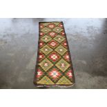 An approx 6'4" x 2' Mamana Kilim rug