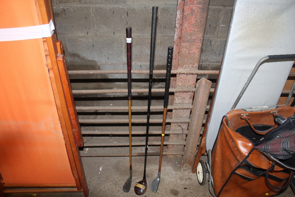 Three golf clubs