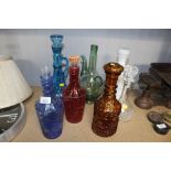 A quantity of glass bottles and stoppers etc.