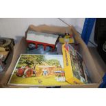 A box containing various games, puzzles, and Thoma