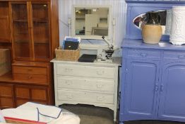A painted dressing chest fitted three long drawers