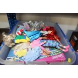 A box containing various Barbie dolls and accessor