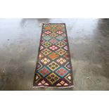 An approx 6'6" x 2'2" Chobe Kilim runner