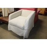 A Multiyork cream upholstered armchair