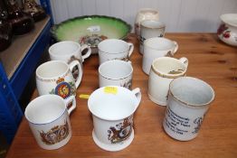 A quantity of commemorative mugs, bowls etc.