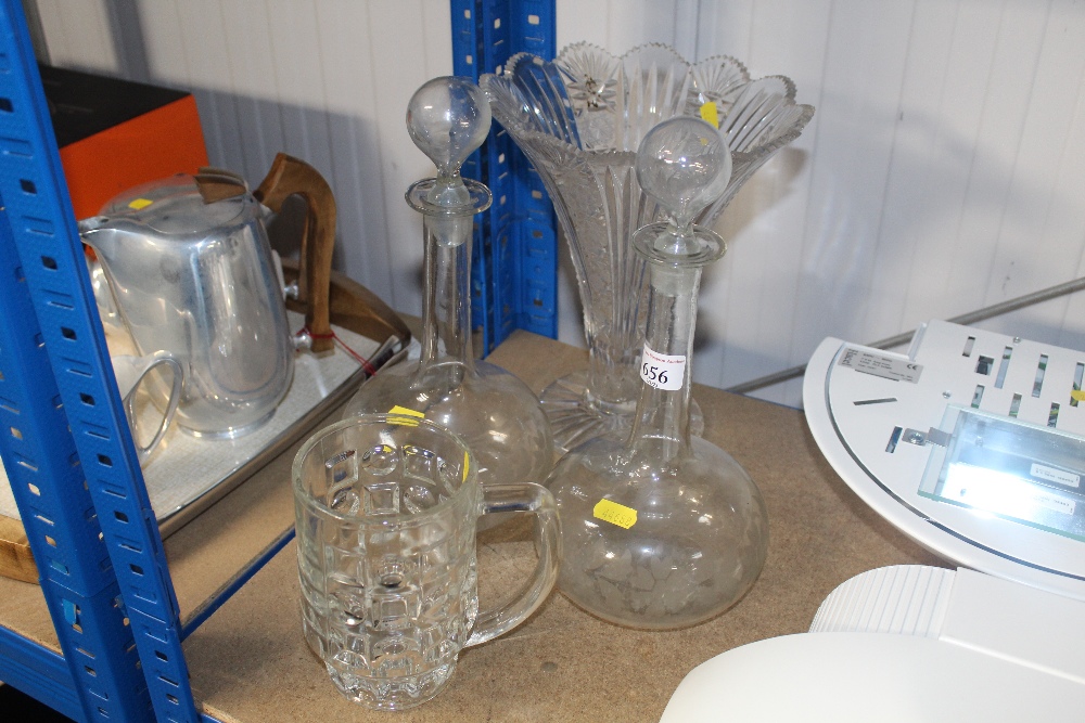 A cut glass vase, a pair of decanters and stoppers