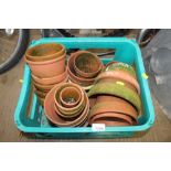 A box of various terracotta planters