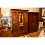 An Edwardian inlaid mirrored door wardrobe, single drawer to base; an Edwardian inlaid mahogany