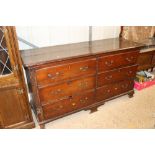 An antique oak converted chest fitted four drawers