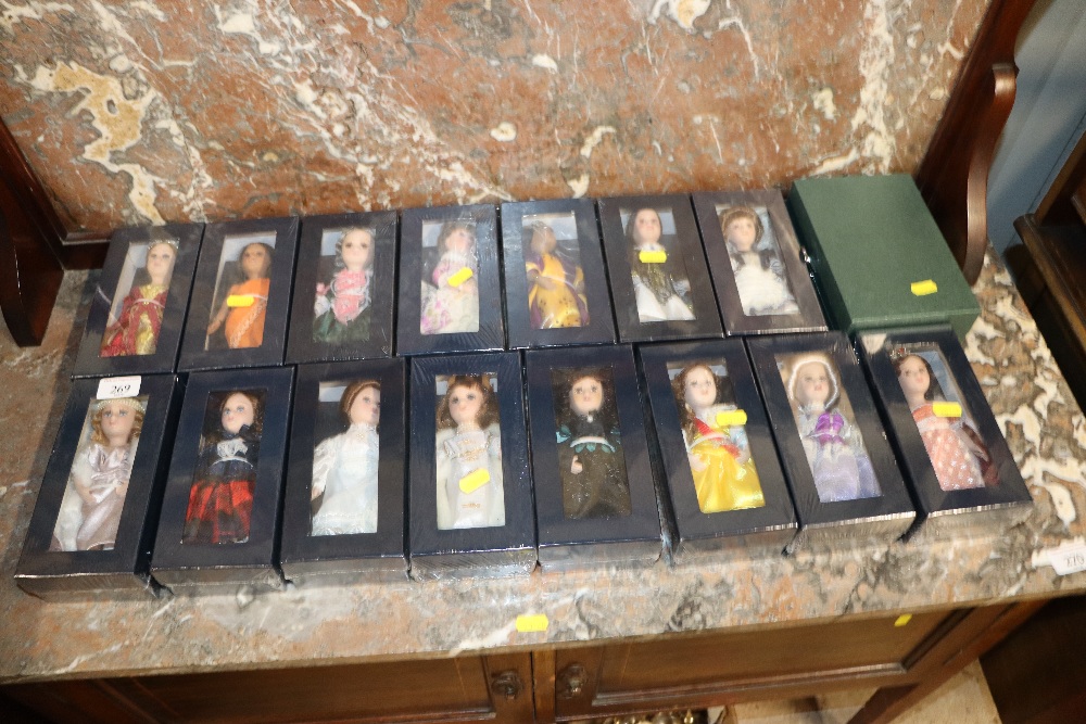 A collection of boxes dressed dolls