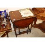 A 1930's oak gate leg tea table