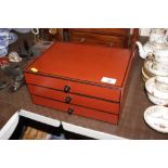 A decorative painted three drawer trinket chest