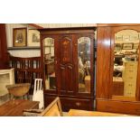 An Art Nouveau style inlaid wardrobe and matching