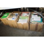 Four boxes containing various books