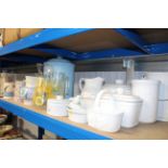 A collection of white glazed storage jars; a jug;