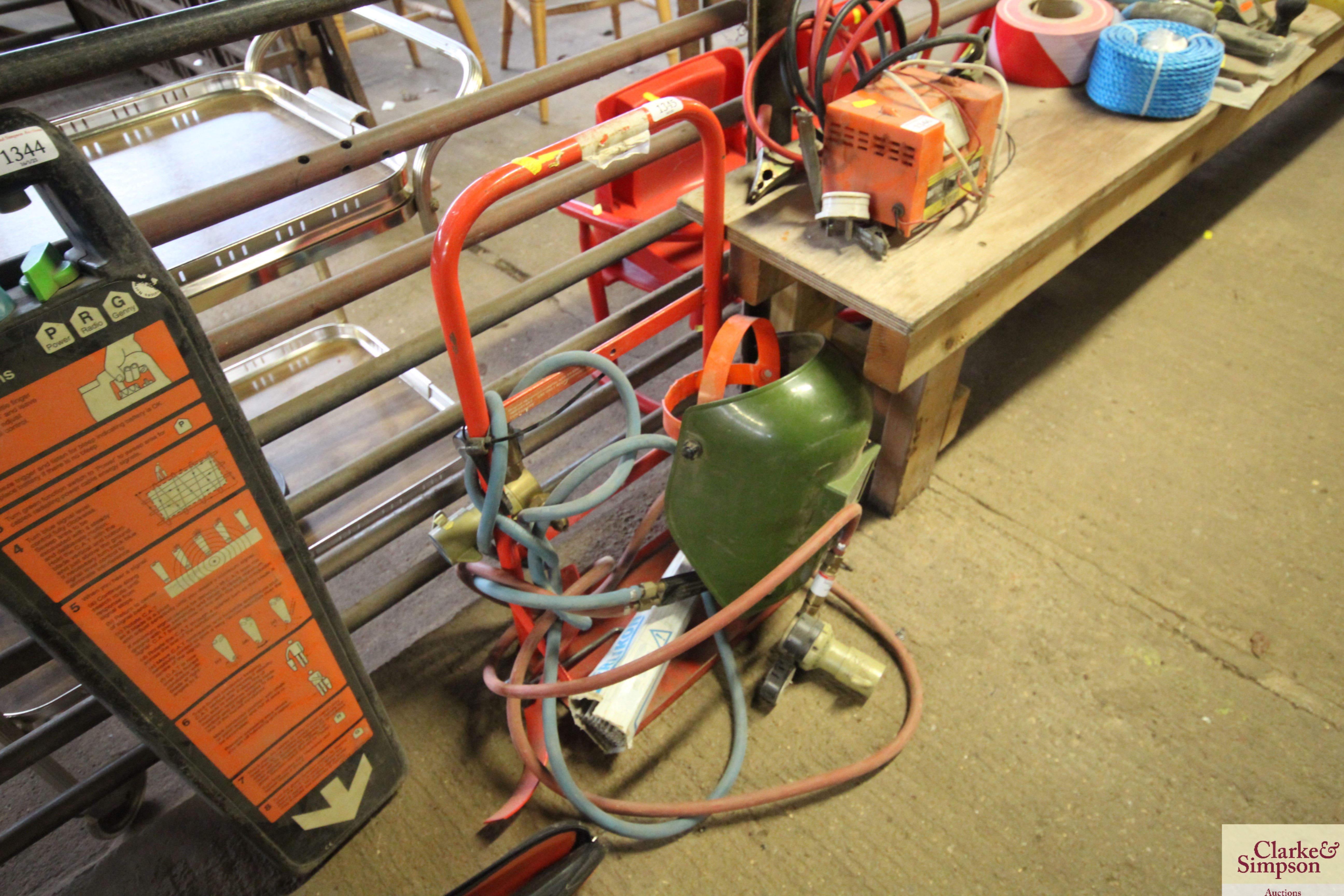 A gas bottle trolley; acetylene torch; welding mas