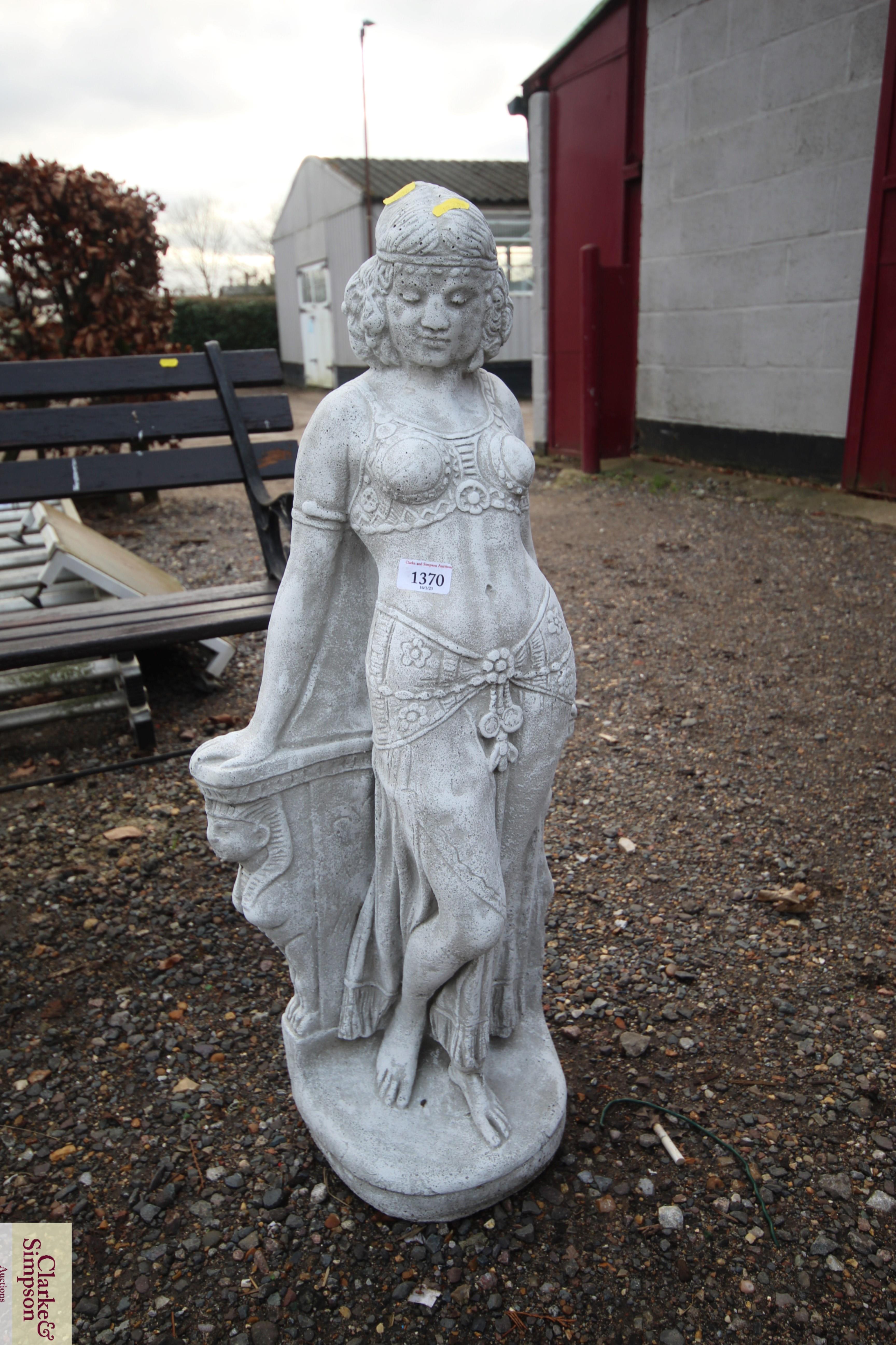 A concrete ornament in the form of Cleopatra