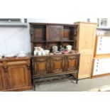 A carved oak and geometric moulded sideboard