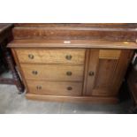 A reproduction chest fitted three drawers and flan