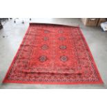 Approx. 7'6" x 5'7" red patterned rug