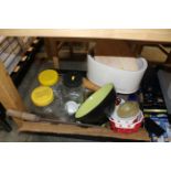 A box containing various cutlery; storage jars and