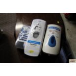 Three hand sanitizer dispensers