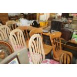Three pine spindle back dining chairs together wit