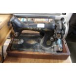 A Singer sewing machine, sold as collectors item