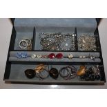 A grey jewellery box and contents of various costume jewellery