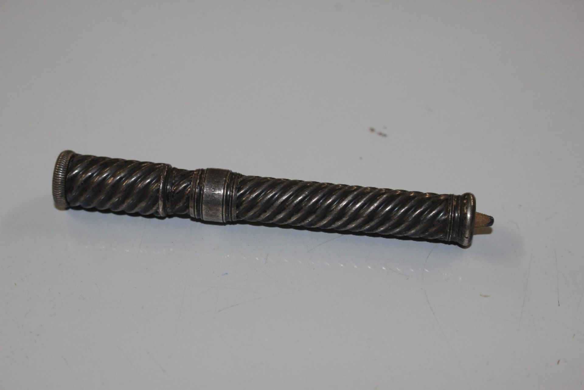 A Sampson Mordan & Co. silver combined push-up pencil holder and sharpener