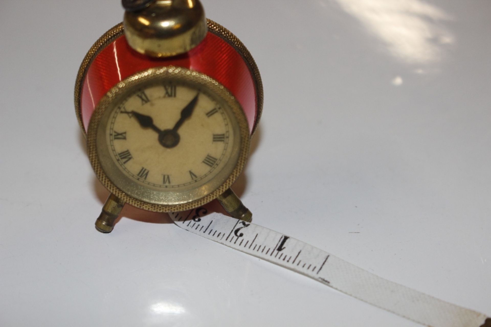 A vintage tape measure in the form of an enamel de - Image 2 of 2