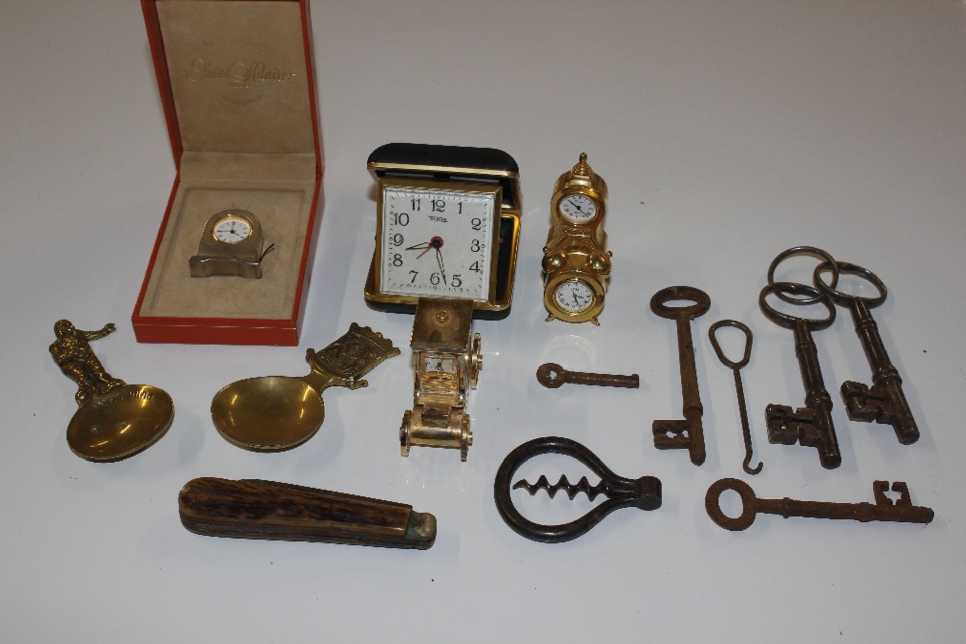 Various antique keys, a brass cased coach timepiec