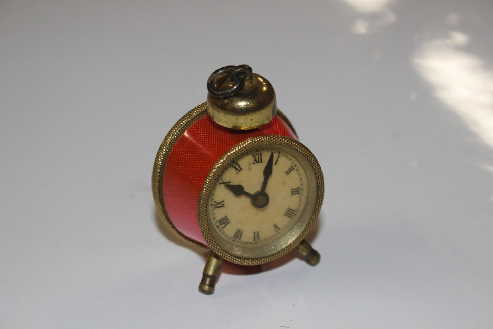 A vintage tape measure in the form of an enamel de