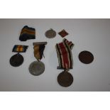 A WWI medal and various medallions; ribbons etc