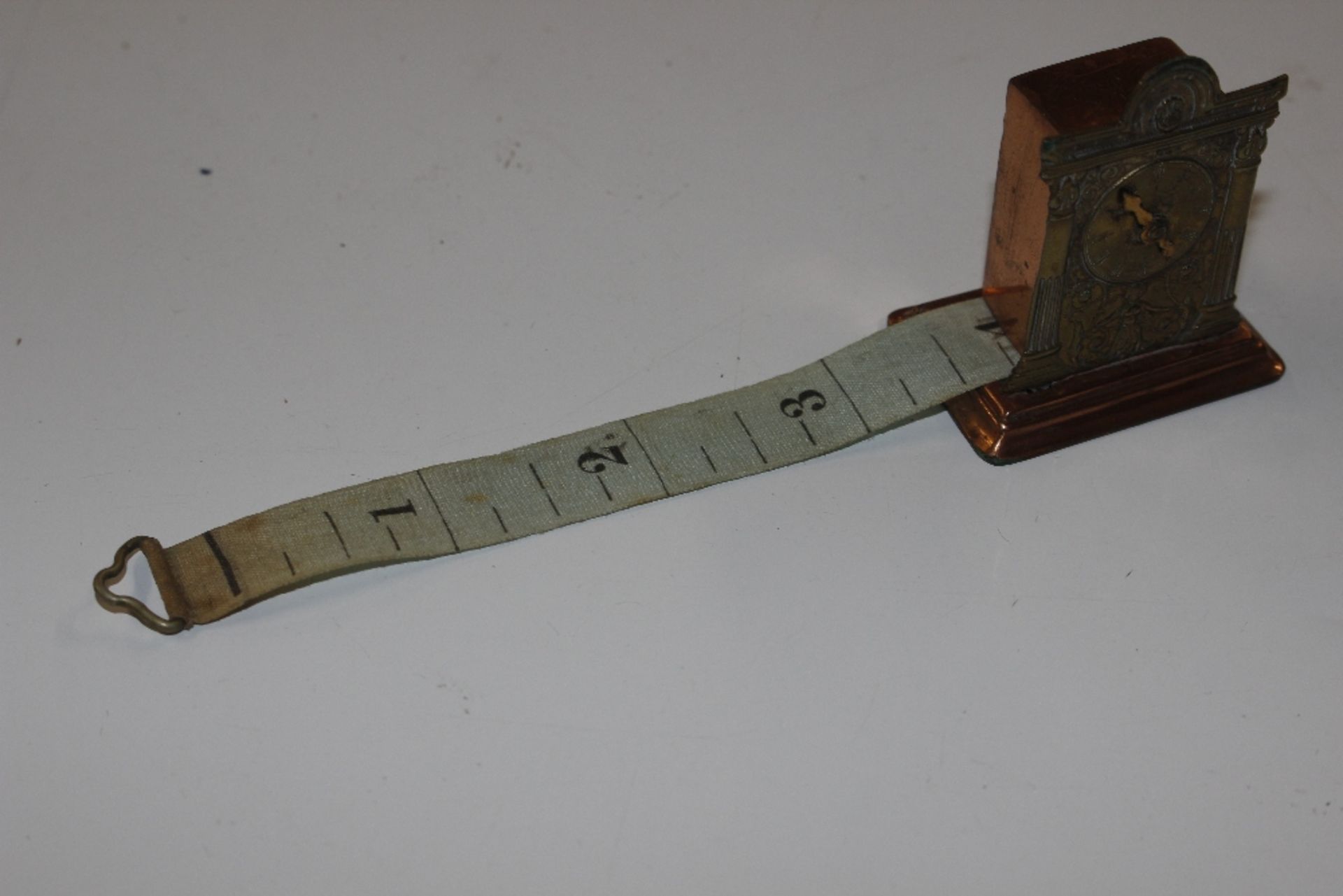 A copper and brass cased tape measure in the form - Image 4 of 4