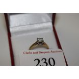 An 18ct gold ring set with ½ ct diamond