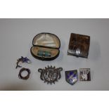 A box of various small items including white metal