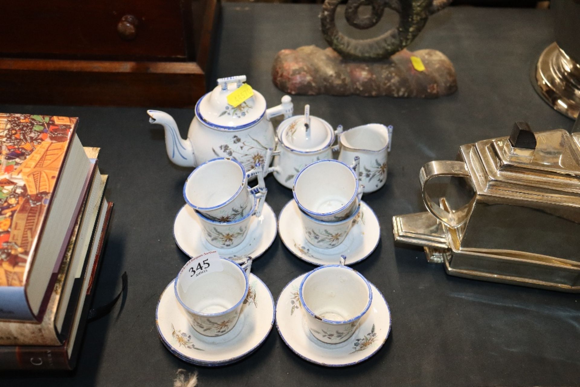 A part-enamelled miniature tea set