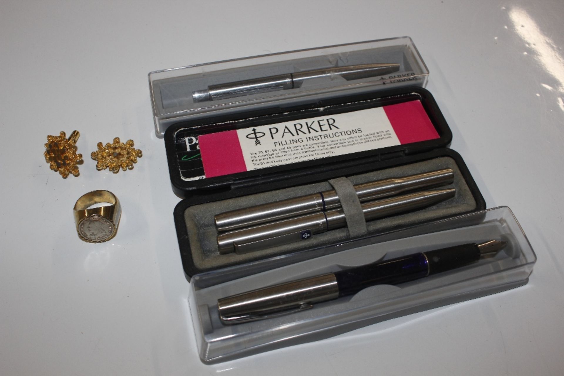 A quantity of various pens, dress ring etc.