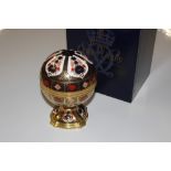 A Royal Crown Derby porcelain Millennium Globe clo
