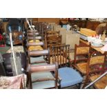 Four oak ladder back chairs; two rush seated ladde