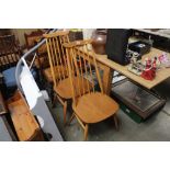 Two light Ercol stick back chairs