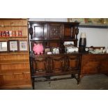 A carved oak and geometric moulded sideboard