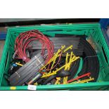 A box containing various Hornby, Scalextric track