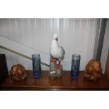 Two blue glass vases; a seagull ornament; and two