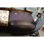 An upholstered foot stool with storage