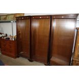 A reproduction mahogany open fronted bookcase