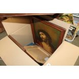 A box containing various religious prints and othe